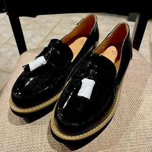 Patent black loafers.